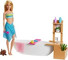 a barbie doll standing next to a bathtub with a dog on the floor in front of it