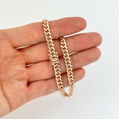 Elevate your style with this exquisite 5mm 14k Rose Gold Miami Cuban Bracelet, skillfully crafted in Italy. Made from genuine 14k rose gold, this bracelet features solid links that exude durability and luxury. The Miami Cuban link design is bold and eye-catching, making it a statement piece that adds a touch of elegance to your wrist. The 5mm size strikes the perfect balance between boldness and wearability, making it suitable for both everyday wear and special occasions. The Italian craftsmansh Rose Gold 14k Tarnish Resistant Bracelets, Rose Gold Tarnish Resistant 14k Gold Bracelets, 14k Rose Gold Tarnish Resistant Bracelets, Rose Gold Vvs Clarity Bracelet, Luxury Rose Gold Cuban Link Bracelets, Luxury Rose Gold Tarnish-resistant Bracelet, Rose Gold Round Bracelet Tarnish Resistant, Rose Gold Cuban Link Bracelet As Gift, Classic Rose Gold Tarnish-resistant Bracelet