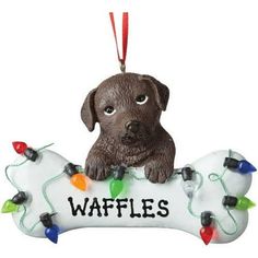 a dog ornament with lights on it that says waffles