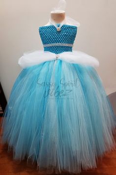 This tutu dress is handmade 100% . It features a stretchy bodice with long tulle to the ground. Sparkly accents, Does come with a sparkly belt. Rhinestone & pearl broach accents. Perfect for Halloween pageants, birthdays, holidays, dress up, etc. Please make sure to measure from the waist to the ground for a perfect fit. Thank you! Embellished Tulle Pageant Dress For Dress-up, Embellished Tulle Princess Dress For Dress-up, Tulle Ball Gown For Costume Party, Fitted Princess Tutu Dress With Glitter Tulle, Princess Style Embellished Tutu Dress For Pageants, Fitted Princess Tutu Dress In Glitter Tulle, Fitted Princess Style Tutu Dress Ball Gown, Princess-style Fitted Ball Gown Tutu Dress, Princess Style Fitted Ball Gown Tutu Dress