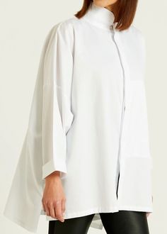 A timeless signature shirt is now available in Planet's fine cotton rib. Style features: a chic mandarin collar and front hidden pocket proven to be a true lifesaver. Details: Mandarin Collar Button Front Placket 100% Cotton Machine Wash Cold One Size (sizeless) Modern White Blouse With Concealed Placket, Timeless Daywear Tops With Placket, Timeless Tops With Placket For Daywear, Modern White Blouse With Placket, Modern Collared Shirt For Daywear, Modern Button-up Shirt For Daywear, Modern Shirt With Spread Collar For Daywear, Classic Shirt For Layering With Shirttail Hem, Modern Tops With Pockets For Daywear