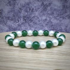 Christmas bracelet Green jade beads size: 8mm White glass pearl beads size: 8mm Color: white, red, green Estimated shipping times United States: 3-5 weeks North America: 3-5 weeks Europe: 9-18 business days I'll do my best to meet these shipping estimates, but cannot guarantee them. Elegant White Christmas Bracelets, Green Pearl Beaded Bracelets As Gift, Christmas Bracelet, Beaded Bracelets Tutorial, Red Bracelets, Jade Bracelet, Jade Beads, Jade Green, Christmas Gifts For Her