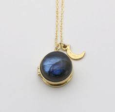 A gold vermeil locket, measuring 16mm, features a stunning labradorite stone.  A tiny moon charm dangles beside it.  It opens to hold two photographs.  ~Locket is gold vermeil (18K gold plated sterling silver) ~Gold plated chain Moon Stone Pendant, Moon Pendant Gold, Gold Lockets, Chain Locket, Jewelry Hacks, Jewelry Lockets, Labradorite Necklace, Gold Locket, Jewelry Personalized