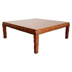 a wooden table sitting on top of a white floor