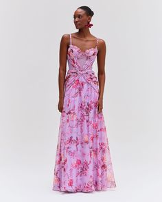 Fitted maxi dress made from a mix of fabrics – a lightweight chiffon and a cotton crochet – both printed with our original floral haze print. Bustier-style bodice features a sweetheart neckline with underwire and boning for added support. Adjustable shoulder straps with chiffon ruffle details. Attached tie belt at wais Alt Wedding, Tropical Maxi Dress, Fitted Maxi Dress, Floral Gown, Fashion Design Dress, Crochet Fabric, Wedding Vibes, Chiffon Ruffle, Cotton Crochet