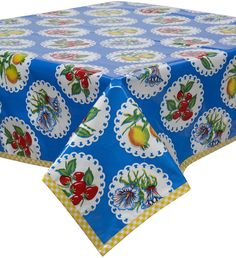 a blue table cloth with fruit designs on it