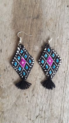 Handmade and embroidered in Chiapas, Mexico.2 3/8" length (not counting metal hooks) by 1 1/8" width Bohemian Beaded Embroidered Earrings For Festivals, Multicolor Embroidered Bohemian Earrings, Traditional Woven Multicolor Earrings, Traditional Multicolor Woven Earrings, Traditional Woven Earrings, Traditional Fringe Earrings, Traditional Woven Earrings For Festivals, Traditional Black Woven Jewelry, Black Embroidered Bohemian Jewelry