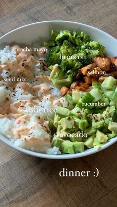 a bowl filled with rice, broccoli and other foods