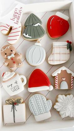 decorated cookies in a white box on a table