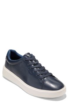 Smooth leather crafts a classic sport inspired low profile sneaker that features a luxuriously comfortable molded footbed that adds comfort to every step. Round toe Lace-up Cushioned insole Padded cuff White sole Leather upper, manmade sole Imported Classic Blue Sneakers With Textured Sole, Comfortable Blue Leather Sneakers, Classic Blue Synthetic Sneakers, Blue Classic Synthetic Sneakers, Classic Sports Sneakers With Removable Insole, Classic Cushioned Sneakers With Plain Toe, Classic Sneakers With Cushioned Footbed, Classic Sneakers With Removable Insole, Leather Low-top Sneakers With Ortholite Insole