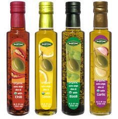 three bottles of different types of olive oil