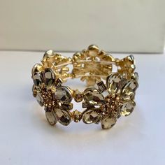 Beautiful Floral Rhinestone Crystal Bracelet. Stretchy Elastic Band. 1.5” Width. Elegant Adjustable Crystal Stretch Bracelet, Glamorous Adjustable Jeweled Bracelets, Glamorous Adjustable Metal Bracelets, Adjustable Glamorous Metal Bracelets, Glamorous Adjustable Bracelet With Bling, Adjustable Gold Glamorous Jewelry, Adjustable Glamorous Gold Jewelry, Adjustable Glamorous Bling Bracelets, Glamorous Adjustable Bling Bracelet