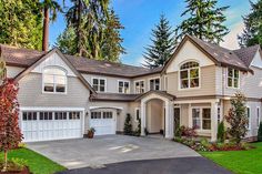 a large house with lots of windows and landscaping