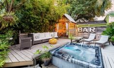 a hot tub sitting on top of a wooden deck