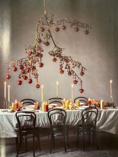 the table is set with candles and ornaments