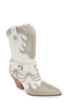 Head west in glamorous style in this rhinestone-bedecked cowboy boot finished with swinging metal chains and a steady block heel. 2 1/2" heel (size 8.5) 8 1/2" shaft Pull-on style Water-resistant Arch support Synthetic upper, lining and sole Imported Asian & Pacific Islander Owned/Founded Western White Embellished Boots, White Western Party Boots, Western High Heel Boots With Rhinestones, Western High Heel Rhinestone Boots, Glamorous White Embellished Boots, Silver High Heel Western Boots, Pacific Islander, Azalea Wang, Perfume Gift Sets