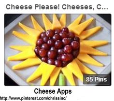 a plate with grapes and cheese on it