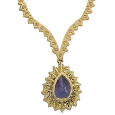 Stamped: 14K Yellow GoldTotal Necklace Weight: 21.7 GramsNecklace Length: 17 InchesNecklace Width: N/AGemstone Weight: Total Natural Tanzanite Weight is 6.56 Carat (Measures: 15.10x10.52 mm)Color: BlueDiamond Weight: Total Natural Diamond Weight is 10.11 CaratColor: F-G, Clarity: VS2-SI1Face Measures: 20.10x16.20 mmSku: [703024W] Luxury Tanzanite Necklaces For Anniversary, Luxury Tanzanite Necklace For Anniversary, Luxury Tanzanite Pear-shaped Jewelry, Luxury Pear-shaped Tanzanite Jewelry, Yellow Gold Pear-shaped Diamond Necklace With Gemstone, Teardrop Tanzanite Jewelry In Yellow Gold, Yellow Gold Tanzanite Pendant Necklace, Yellow Gold Tanzanite Jewelry With Gemstone Accents, Gold Tanzanite Teardrop Jewelry