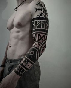 a man with a tattoo on his arm