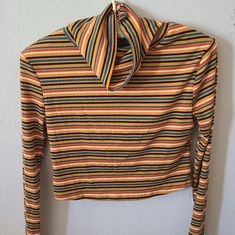 See You Monday Long Sleeve Stripped T-Shirt Size Medium Colors: Mustard Yellow, Rust, Cream,Brown And Turquoise 80% Polyester 16% Rayon 4% Spandex Measurement From Armpit To Armpit 15", Length 15" With Look Adorable Paired Up With Your Favorite Jeans And Boots Please View My Photos It Is Part Of My Description Smoke Free And Cat/Dogs Loving Home Make An Offer Thank You For Looking At My Item Multicolor Stretch T-shirt For Fall, Casual Orange Crop Top For Fall, Trendy Orange Crop Top For Fall, Trendy Multicolor Tops For Fall, Trendy Multicolor Tops, Trendy Orange Crew Neck Top, Retro Orange Tops For Fall, Casual Multicolor Crop Top For Fall, Trendy Long Sleeve Orange Top