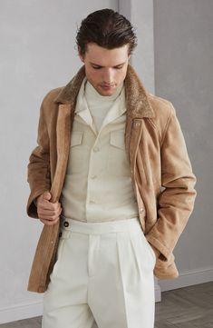 Manufacturing of the shearling gives the exterior a pleasant sueded texture and preserves the reverse side's classic, soft wool appearance. Double closure with zip and snaps Shirt-style collar Upper patch pocket with button Hand pockets with flap and button Classic Suede Outerwear With Concealed Placket, Beige Leather Outerwear With Lapel Collar, Luxury Suede Outerwear With Button Closure, Classic Suede Outerwear With Flap Pockets, Classic Collared Suede Outerwear, Luxury Long Sleeve Suede Outerwear, Classic Shearling Outerwear With Pockets, Classic Beige Outerwear With Corduroy Collar, Classic Shearling Long Sleeve Outerwear