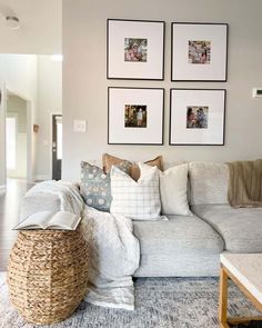 a living room filled with lots of furniture and pictures on the wall above it's couch