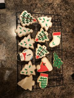 decorated christmas cookies on a cooling rack