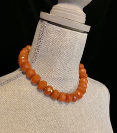 "This gorgeous carnelian choker features 27 large faceted amber color beads. Each bead is .625\" wide x .325\" thick. The over all length is approximately 17.75\". The tiny spacer beads are sterling silver. It is finished with a handmade silver toggle clasp. Length 16\" Width .625\" Additional Information: * Complimentary Gift Box! * All jewelry items come securely packaged and are mailed promptly upon payment - often same-day. * The majority of my vintage items are used and may show some wear. Orange Round Faceted Beads Jewelry, Orange Faceted Beads For Crafting, Orange Faceted Beads For Jewelry Making, Faceted Amber Round Bead Jewelry, Adjustable Carnelian Jewelry With Faceted Beads, Faceted Orange Beaded Necklace As Gift, Orange Vintage Jewelry With Faceted Beads, Vintage Orange Jewelry With Faceted Beads, Spiritual Orange Jewelry With Faceted Beads