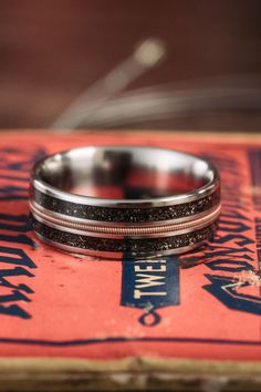 space-cowboy-titanium-guitar-string-meteorite-rustic-and-main Cowboy Ring, Guitar String Ring, String Ring, Adventurous Men, Rustic Wedding Bands, Wedding Ring Sets Unique, Unique Wedding Band, Cowboy Wedding, Cowboys Men