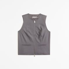 Elevate your wardrobe with the A&F Mara Zip-Up Vest, a perfect blend of style and comfort. This vest is designed for the modern woman, featuring a chic dark gray color that complements any outfit.

- Size: XS
- Color: Dark Gray
- Material: Polyester, Viscose, Elastane
- Gender: Female
- Features: Zip-up front, on-trend seaming details, front pockets

Crafted from a soft synthetic blend, this vest offers both warmth and flexibility, making it ideal for layering over your favorite shirts and blous Zipper Closure Sleeveless Vest For Work, Sleeveless Workwear Vest With Zipper Closure, Chic Vest With Zipper Closure, Chic Workwear Tops With Zipper Closure, Chic Tops With Zipper Closure For Work, Casual Fitted Vest With Zipper Closure, Sleeveless Outerwear With Zipper Closure For Work, Chic Sleeveless Vest With Zipper Closure, Spring Workwear Vest With Zipper Closure