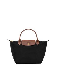 In a miniature size, Longchamp's signature nylon tote lends sophisticated style to every look. The lightweight design folds up for ease during travel. Nylon Handbag, Top Handle Handbags, Nylon Tote, Folded Up, Longchamp Le Pliage, Black Handbags, Sophisticated Style, Small Tops, Top Handle