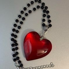 Black Beaded Necklace With Big Large Red Glass Crystal Heart Pendant Charm Brand New Big Red Crystal Glass Heart Charm Pendant Choker Necklace 3d Heart Pendant Chunky Heart Necklace Super Adorable Necklace, You Will Love The Contrast Between The Red Heart And The Black Of The Beads. *Glass Heart Pendant Size: 43mm *Necklace Length: 34cm+5cm Extension Chain. *Brand New. *Will Ship Next Day Or Same Day If Possible. *Make A Bundle Of 2 Or More Items And Save $2 (Message Me First!) #Bigredcrystalhea Heart-shaped Beaded Necklace For Parties, Handmade Black Necklace For Valentine's Day, Black Heart Beads Necklace For Valentine's Day, Black Heart Beads Necklace, Big Red Heart Necklace, Handmade Black Heart Beaded Necklaces, Black Heart Beaded Necklace, Red Crystal Heart Necklace, Black Beaded Heart-shaped Jewelry