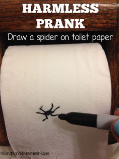 someone is drawing a spider on toilet paper