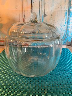 a glass bowl sitting on top of a blue mat