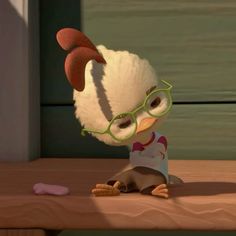 an animated chicken with glasses and a sweater sitting on a wooden table next to a wall