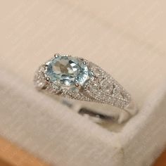 This ring features a 6*8 mm oval cut aquamarine. Customization is available. It is made by hand, and it will take about 7 days to finish the ring after your payment is completed. Main stone: 6*8 mm oval cut Main stone weight:1.13 ct Metal type: sterling silver /14k gold Accent stone: cz Customization is available, just fee free to contact me, it is free to engrave inside the ring, it is free, you can leave a ntoe with your order, but it will be great no more than 15 letter. Any question, just le Luo Jewelry, March Birthstone Ring, September Birthstone Rings, Blue Gemstone Rings, Sparkly Ring, Aquamarine Engagement Ring, Natural Gemstone Ring, Silver Anniversary, Aquamarine Ring