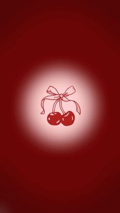 two cherries tied with a bow on a red background