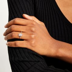 a woman's hand with a ring on it