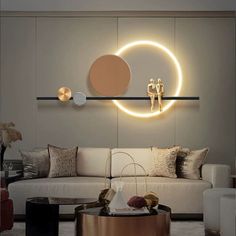 a living room filled with furniture and a circular light on the wall above it's coffee table