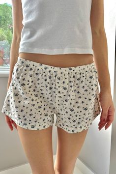 Pajama shorts with an elastic waistband and button down detailing. Fabrics: 100% Cotton Measurement: 8" (20cm) rise, 2.5" (6cm) inseam, 26" (66cm)waist (stretches) Made in: China Floral Lounge, Embrace Yourself, College Closet, Sweats Outfit, Accept Yourself, Clothing To Make, White Bottoms, Pj Shorts, Bday Gifts