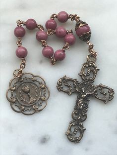 Beautiful First Communion pocket rosary. 6 and 8mm Rhodonite Gemstones 20 gauge solid bronze wire Bronze Medals Bronze Rosary As Gift, Bronze Rosary With Round Beads As Gift, Antique Jewelry With 8mm Beads For Gift, Antique 8mm Beads Jewelry As Gift, Antique Jewelry With 8mm Beads As Gift, Vintage Bronze Rosary As Gift, Antique Handmade Rosary As Gift, Antique 8mm Beads For Jewelry Making, Saint Agatha