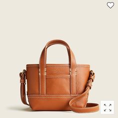 New With Tag J. Crew Leather Mini Montauk Tote Handbag. Can Be Used As A Crossbody Or A Satchel. Super Cute And Just The Right Size When You Want To Carry A Few Necessities. Gorgeous Leather. - Color: Rich Oak - Dimensions Approx.: 8”W X 5 1/2”H X 2 3/4”D - Free J. Crew Dustbag Included With This Purchase - Adjustable, Removable Leather Strap - 3” Handle Drop, 22” Maximum Strap Length Thank You For Shopping @Shinebrightshop. Tan Leather Box Bag For Shopping, Leather Tan Bucket Bag For Errands, Tan Leather Bucket Bag For Errands, Leather Tan Box Bag For Everyday Use, Everyday Tan Leather Box Bag, Tan Leather Box Bag For Everyday Use, Tan Leather Box Bag With Removable Pouch, Tan Crossbody Box Bag For Everyday, Tan Leather Satchel For Errands