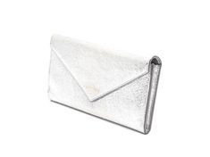 This long "Papier" envelop wallet from Balenciaga is not only fun, but function. Both the exterior and interior is crafted with a bright metallic silver crinkled leather. The front of the wallet features the iconic Balenciaga logo debossed in gold. The interior of the wallet features card slots, bills slots, and a zipper pocket.    Model: 499207  Color: Metallic silver    Silver-toned hardware  Envelope flap snap closure   Twelve card slots  Two bill slots  One zipper pocket  Measurements: 7.5 x Luxury Silver Wallet For Travel, Luxury Silver Travel Wallet, Silver Leather Wallets, Envelope Wallet With Card Slots For Evening, Evening Envelope Clutch With Card Slots, Envelope Clutch With Card Slots For Evening, Silver Bifold Wallet For Formal Occasions, Chic Silver Rectangular Wallets, Silver Leather Evening Wallets