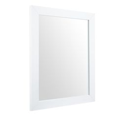 a white framed mirror on a wall