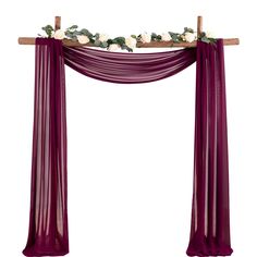 a purple wedding arch with white flowers and greenery on the top, hanging in front of a white background