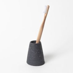 A more elegant and minimalist way to hold your toothbrush. Easily holds 1-2 standard size toothbrushes. Each holder is individually hand cast from custom-made rubber molds and sourced from recycled materials. Natural voids occur during casting, resulting in very small pin holes in some pieces. Pair tooth brush holder with soap dish with any of the Jao Soaps to make a useful gift. Size:2.5"W x 3"H Care:Do not submerge in water. Wipe clean with mild soap and water. Made in Houston, TX Concrete Work, Black Terrazzo, Toothbrush Holders, Mini Soaps, Skin Care Kit, For Your Eyes Only, Small Pin, Soap Gift, Body Brushing