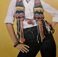 a woman in a white shirt and colorful scarf