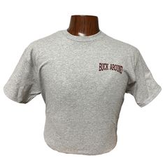 Buck Around and Find Out T-Shirt in Gray Make a bold statement with our "Buck Around and Find Out" T-Shirt in Gray. This t-shirt combines comfort, style, and a touch of humor. Whether you're heading out to the rodeo or just want to showcase your rugged personality, this tee is a must-have addition to your wardrobe. Key Features: Eye-Catching Design: Features the bold and witty phrase "Buck Around and Find Out" printed on the back , making it a conversation starter. Premium Quality Fabric: Made f Rugged Look, Mens Shoes Boots, Comfort Style, Western Wear, Favorite Jeans, Boot Shoes Women, Rodeo, Cargo Pants, Design Features