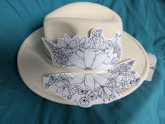 Desert Marigold, Desert Willow, Brittlebrush, Purple lupine, Mexican poppy, prickly pear cactus, agave, desert mallow.  I can burn the design into the hat. You can decide if you would like to add color. Fedora Burning, Desert Mallow, Pyrography Hats, Mexican Poppy, Desert Marigold, Butterfly Ceiling, Purple Lupine, Cowboy Cactus, Cowboy Hat Design