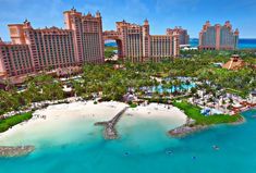 an aerial view of the resort and beach